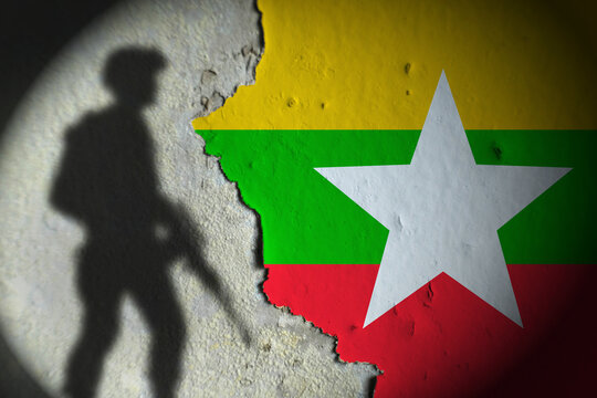 junta militer myanmar. myanmar flag and soldier shadow