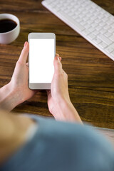 Digital png photo of caucasian woman holding smartphone with blank screen on transparent background
