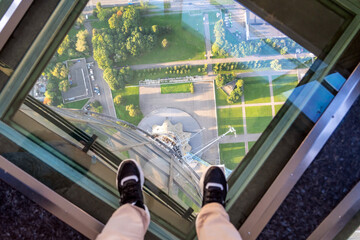 Female feet on glass floor at the Ostankino tower in Moscow, Russia