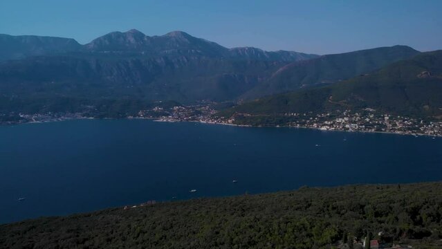 Bay Of Kotor Overlooking The Coastal Villages Of Herceg Novi And Denovici In Montenegro. Aerial Panning Right Shot