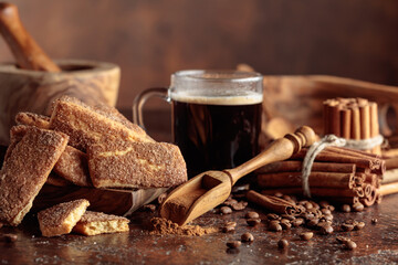 Sweet cinnamon cookies and a mug of black coffee.