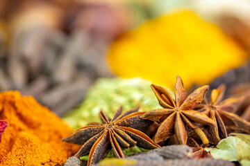 Various spices, peppers and herbs close-up top view. Eastern spice market. A set of peppers and spices for cooking.