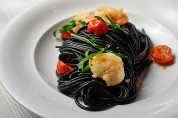 Spaghetti al Nero di Seppia con Gamberi, Italian Pasta with Squid Ink, Prawns, Tomato and Rucola