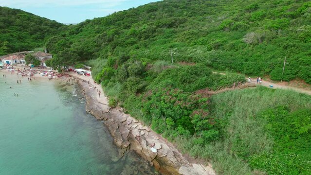 Aerial orbit of the wooden steps at the entrance of the Azeda Beach in B&uacute;zios, Brazil. Crystalline waters of Rio de Janeiro