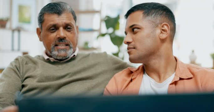 Senior father, son and laptop on sofa with talk, app or relax together in family home for bonding. Men, computer and discussion with social network app, article or news with parent for quality time