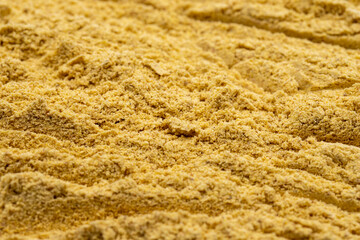 Pile of Ginger powder as background, spice or seasoning as background. Close-up Ginger powder