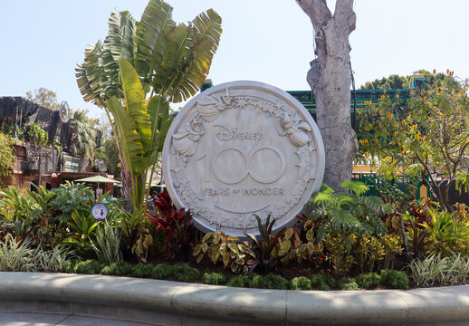 View of the platinum Disney 100 Years of Wonder medallion at the Downtown Disney District mall. Anaheim, CA USA on May 13, 2023.