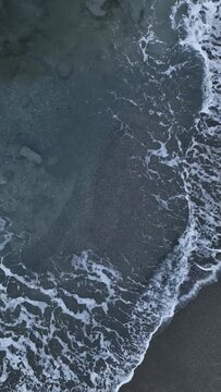 Vertical video Take viewers on a breathtaking journey, capturing the ethereal beauty of foggy clouds over a calm Mediterranean sea.