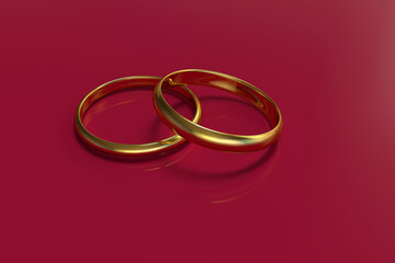 Two gold rings on a red background