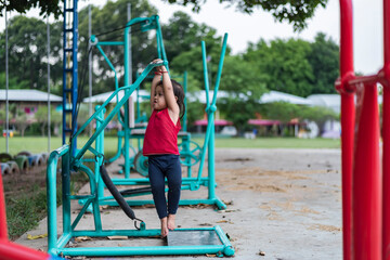 Kids playing on outdoor playground, kids playing in school or kindergarten, kids active on colorful slides and swings, healthy summer activities for kids.