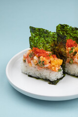 Portion of japanese hand rolls with shrimp and caviar