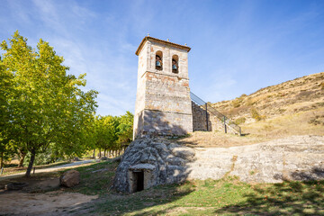 Fototapeta na wymiar Bell tower of the church of Saints Justo y Pastor in Olleros de Pisuerga, municipality of Aguilar de Campoo, Palencia, Castile and León, Spain