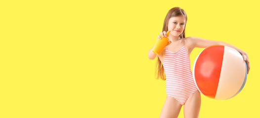 Little girl with sunscreen cream and beach ball on yellow background with space for text