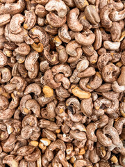 Cashew nuts as background, top view
