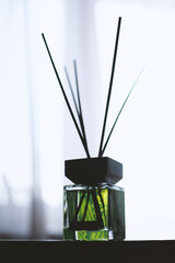 Bottle of green home perfume