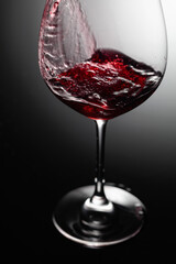 Closeup of red wine pouring.
