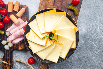raclette cheese snack appetizer food on the table copy space food background rustic top view