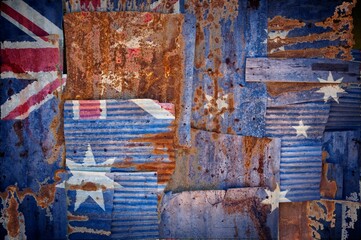 Abstract background image of Australia painted flag on rusty corrugated iron sheets