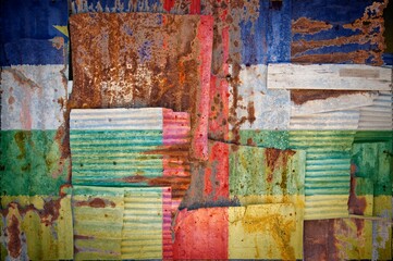 Background of the flag of the Central African Republic painted on rusty corrugated iron sheets