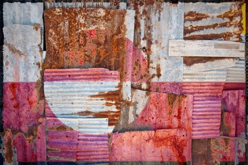 Abstract background of the flag of Greenland painted on rusty corrugated iron sheets