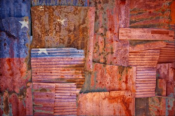 Flag of Samoa painted onto rusty corrugated iron sheets overlapping to form a wall or fence