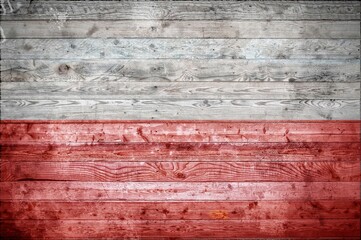 Flag of Poland painted onto wooden boards of a wall or floor