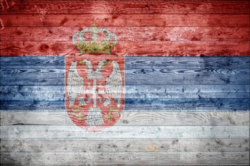 Flag of Serbia painted onto wooden boards of a wall or floor