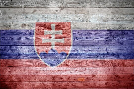 Vignetted background image of the flag of Slovakia onto wooden boards of a wall or floor