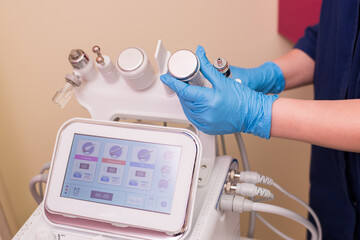 Attachments to the HydraFacial device for facial skin care in a spa clinic to combat acne or aging. The concept of aesthetic medicine, self-care, the latest technologies in the beauty industry
