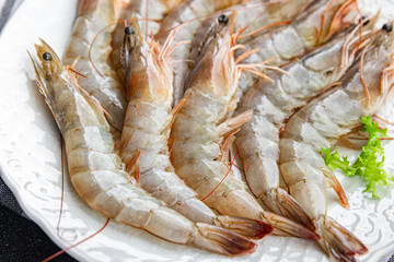 fresh shrimp raw prawn gambas seafood meal food snack on the table copy space food background...