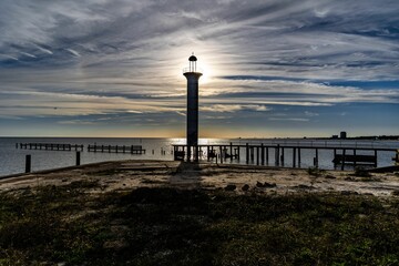 Silhouette of the lighthouse during the sunset