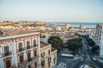 Aerial view of cityscape and Palazzo Valdes and blue sea on the horizon in Cagliari, Italy