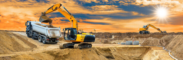 excavator is working and digging at construction site