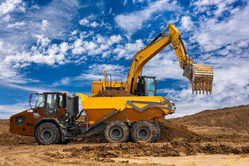 excavator is working and digging at construction site