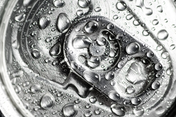 Beer can cap with water drops.