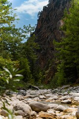 Vertical shot of the Samaria Gorge near Lakki, Crete, a small river running through