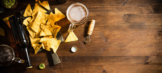 Fresh beer with corn chips. - 606765116