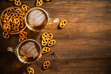 Beer in glasses with salted pretzels.