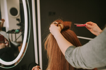 Putting rollers on  at the hair salon