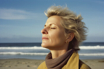 Portrait Of Mature Woman Relaxing On Beach, Looking Away