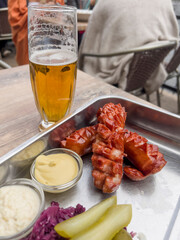 grilled sausages and beer on table