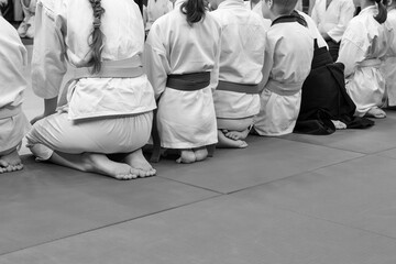Children in kimono sitting in a line on tatami