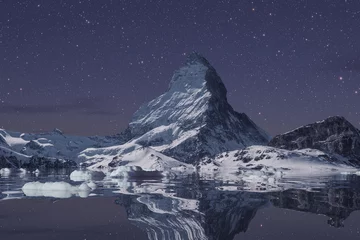 Vlies Fototapete Reflection The majestic Matterhorn reflected on the lake on a starry night
