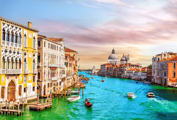 Gondolas and boats in the Grand Canal of Venice near Santa Maria della Salute, Italy