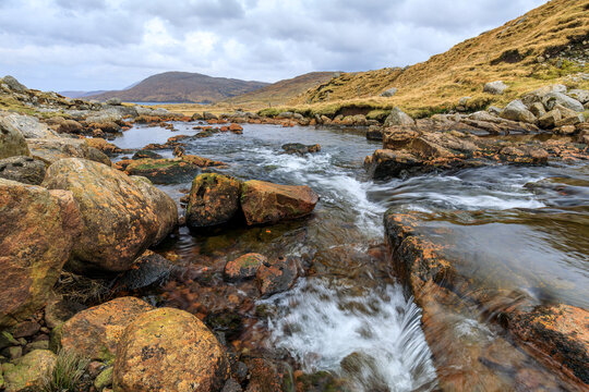 The Abhainn Sgaladail river flowing from the mountains of North Harris into Loch Shiphoirt and Loch Seaforth on the Isle of Harris, Outer Hebrides, Scotland