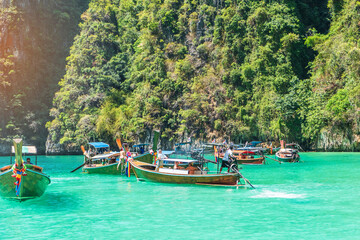 Naklejka na ściany i meble Long tail boat at Pileh lagoon on Phi Phi island, Krabi, Thailand. landmark, destination Southeast Asia Travel, vacation and holiday concept