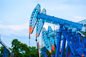 In the field country crude oil industry the oil rig pump in the evening of the pumping