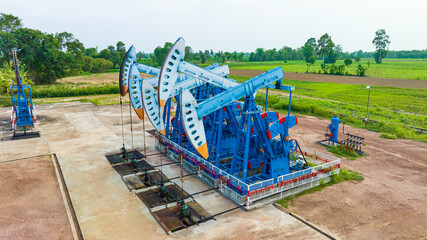 Fototapeta na wymiar Top view In the field crude oil country industry the oil rig pump in the evening of the pumping unit
