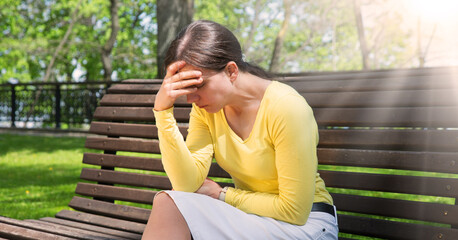 Pretty girl sitting on the bench
