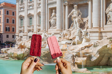 Tourist holding an ice cream in front of the Trevi Fountain, Rome